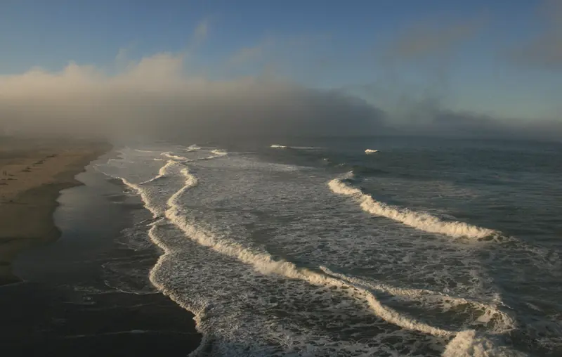 Photo of waves and lifting fog at Ocean Beach in San Francisco
